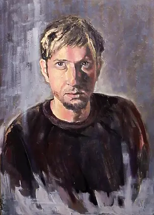   - A man in a dark sweater