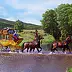Ewelina Greiner - quattro cavalli che tirano la diligenza nel flusso